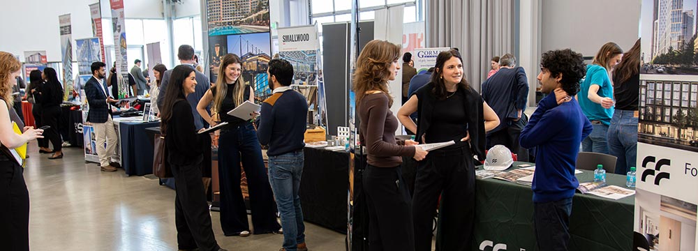 Students speak with industry professionals at the career fair
