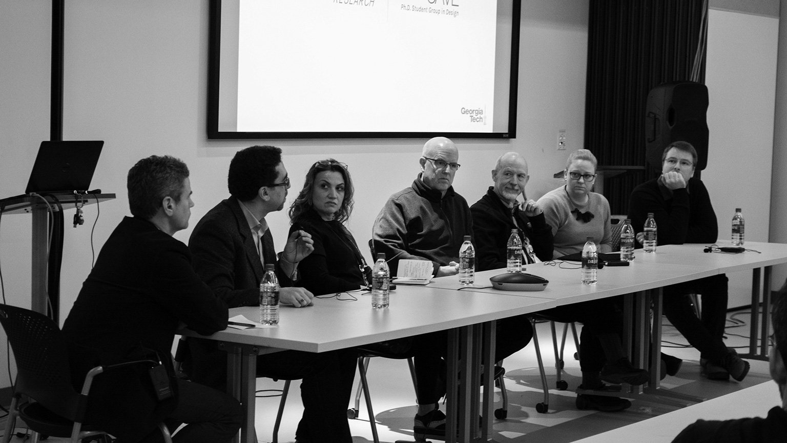 Black-and-white photo of a discussion panel